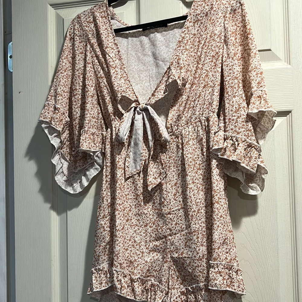 short rust romper with flower design